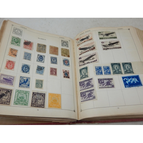 31 - Superb vintage Strand stamp album containing a massive collection of GB and world stamps