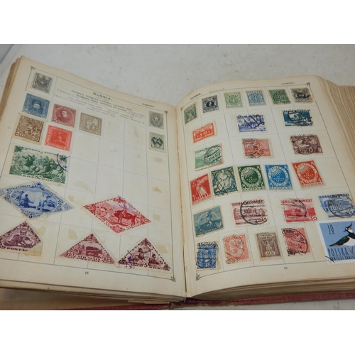 31 - Superb vintage Strand stamp album containing a massive collection of GB and world stamps