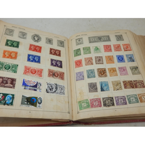 31 - Superb vintage Strand stamp album containing a massive collection of GB and world stamps