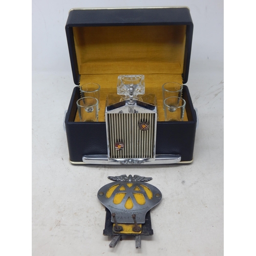 502 - A 1960's Rolls Royce Whisky Decanter & 4 Glasses together with a Vintage AA Car Badge.