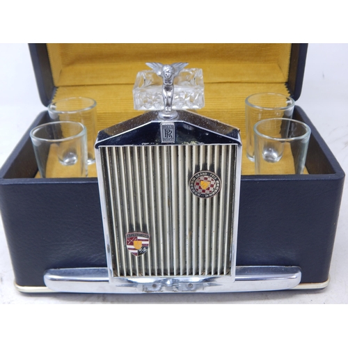 502 - A 1960's Rolls Royce Whisky Decanter & 4 Glasses together with a Vintage AA Car Badge.