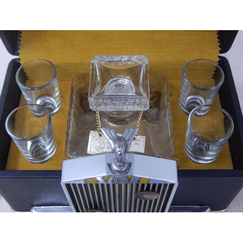 502 - A 1960's Rolls Royce Whisky Decanter & 4 Glasses together with a Vintage AA Car Badge.