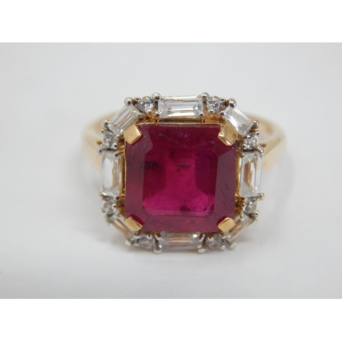 264 - Gold Ring Set with a Central 5.59ct Malagasy Ruby within a Border of White Zircons. Size N/O, gross ... 