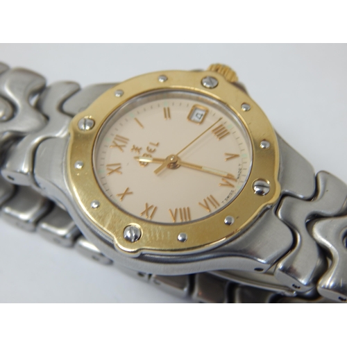 265 - Ladies Ebel Wristwatch with Date Aperture, Sweep Seconds Hand & Yellow Metal Bezel.