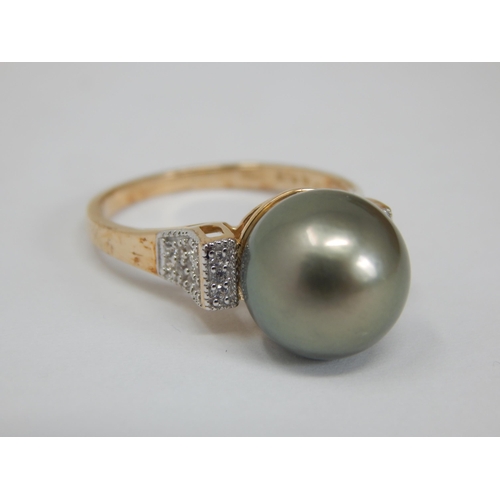 268 - Gold Ring Set with an 11mm Tahitian Pearl & White Zircons: Size N/O, gross weight 4.10g