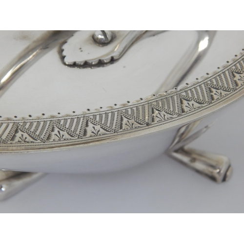 100 - Christopher Dresser (1834-1904). A silver plated 'Crows Foot' design spoon warmer with engraved foli... 