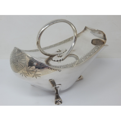 100 - Christopher Dresser (1834-1904). A silver plated 'Crows Foot' design spoon warmer with engraved foli... 