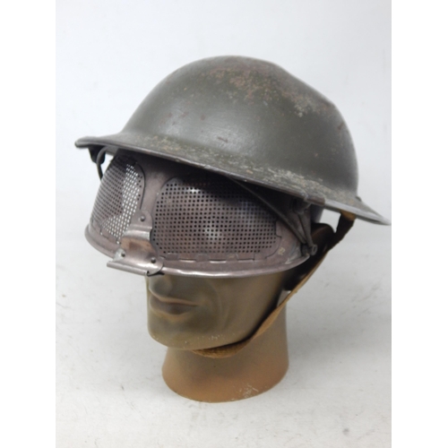 236 - Rare Steel Helmet With Cruise Visor, standard pattern British steel helmet with much of the original... 