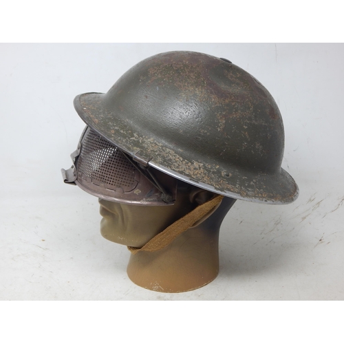 236 - Rare Steel Helmet With Cruise Visor, standard pattern British steel helmet with much of the original... 