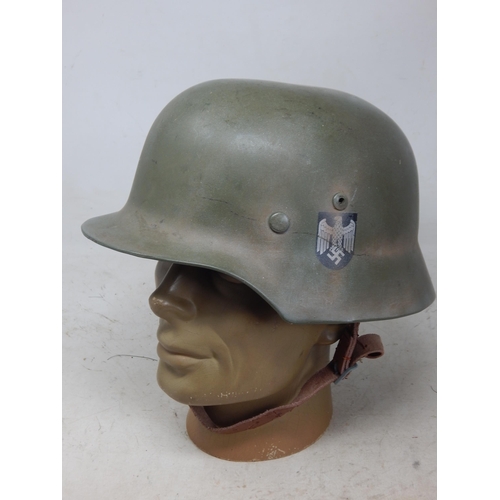 242 - WWII German Helmet with Double Decals. Note: Customers must satisfy themselves prior to bidding in r... 