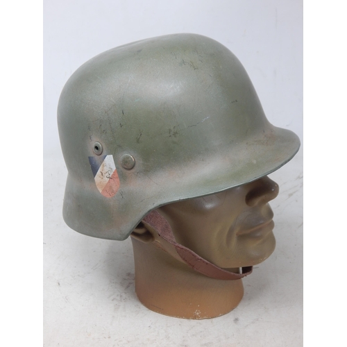 242 - WWII German Helmet with Double Decals. Note: Customers must satisfy themselves prior to bidding in r... 