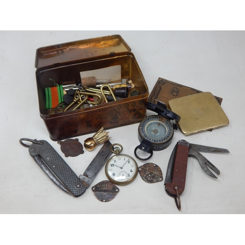 189 - A Tin Containing an assortment of Military Items Including WWII Penknife dated 1941, GSTP Pocket Wat... 