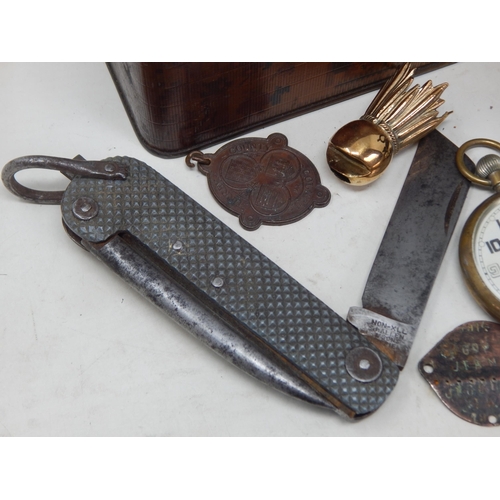 189 - A Tin Containing an assortment of Military Items Including WWII Penknife dated 1941, GSTP Pocket Wat... 