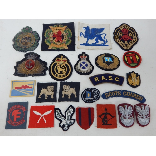 194 - A Quantity of Military Cloth Badges