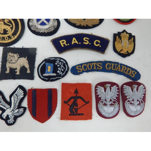 194 - A Quantity of Military Cloth Badges