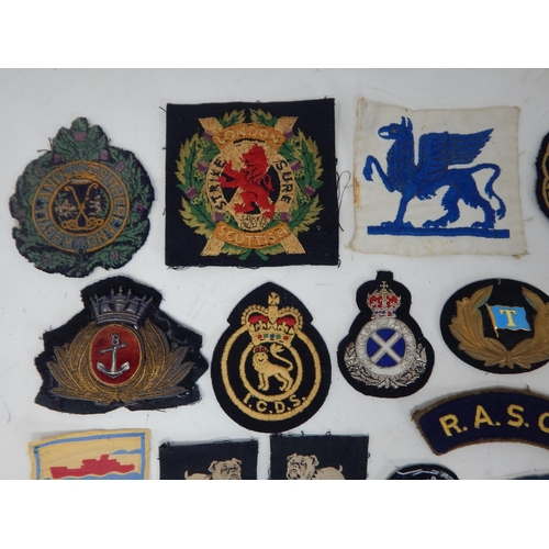 194 - A Quantity of Military Cloth Badges
