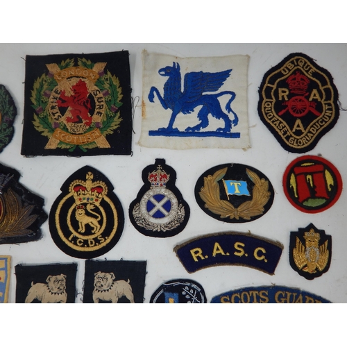 194 - A Quantity of Military Cloth Badges