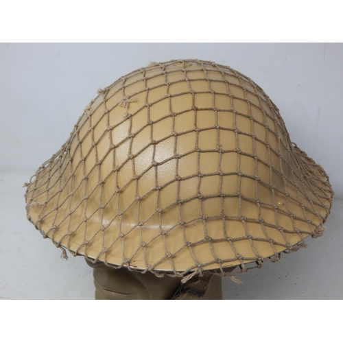 274 - WWII British Tommy Steel Helmet with Netting. Please Note: Customers must satisfy themselves prior t... 