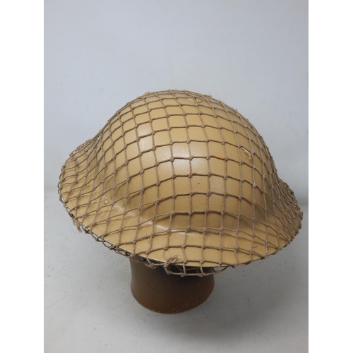 274 - WWII British Tommy Steel Helmet with Netting. Please Note: Customers must satisfy themselves prior t... 