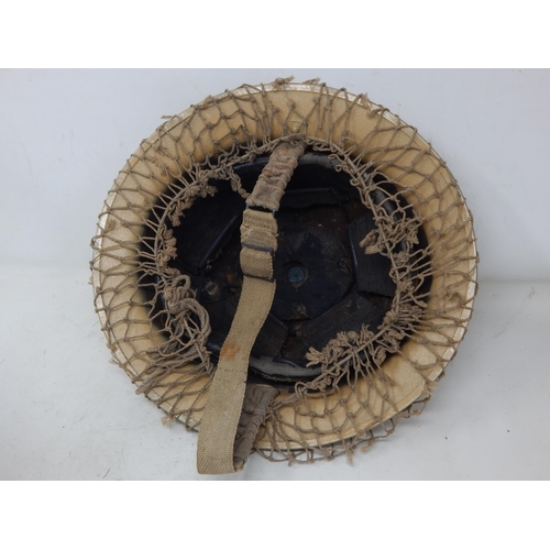 274 - WWII British Tommy Steel Helmet with Netting. Please Note: Customers must satisfy themselves prior t... 