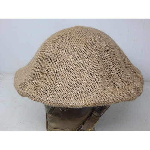 279 - WWI British Brodie Helmet with Hessian Cover. Please Note: Customers must satisfy themselves prior t... 