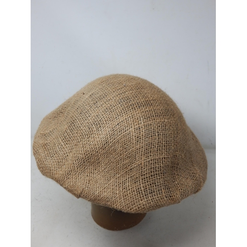 279 - WWI British Brodie Helmet with Hessian Cover. Please Note: Customers must satisfy themselves prior t... 