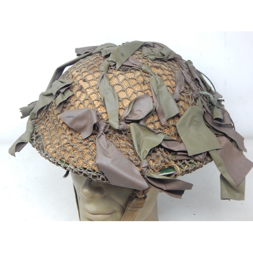 281 - WWII 1940 Dated British Mk II Brodie Helmet with Net & Camouflage. Please Note: Customers must satis... 