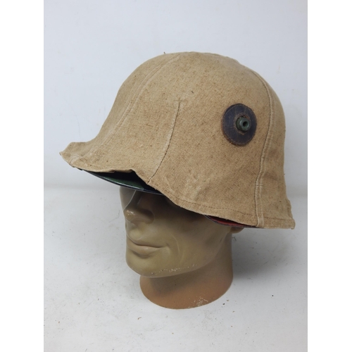 283 - WWII German Camouflage Helmet with Hessian Cover. Please Note: Customers must satisfy themselves pri... 