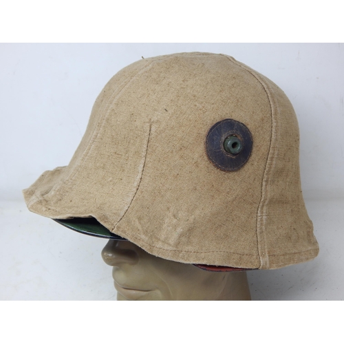 283 - WWII German Camouflage Helmet with Hessian Cover. Please Note: Customers must satisfy themselves pri... 