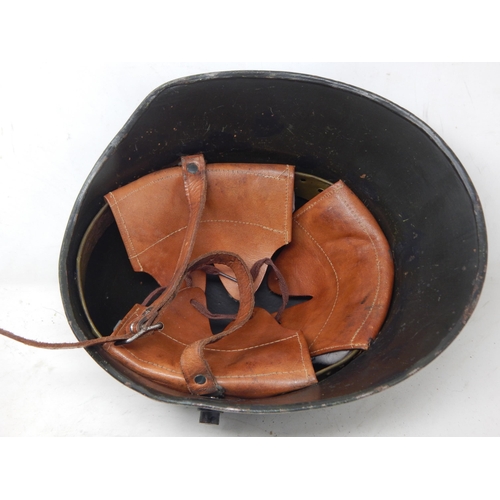 285 - WWII German Gunners Steel Helmet. Please Note: Customers must satisfy themselves prior to bidding in... 