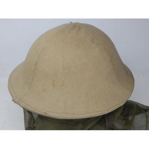 293 - WWII British Brodie Helmet with Hessian Covering & Mosquito Netting. Please Note: Customers must sat... 