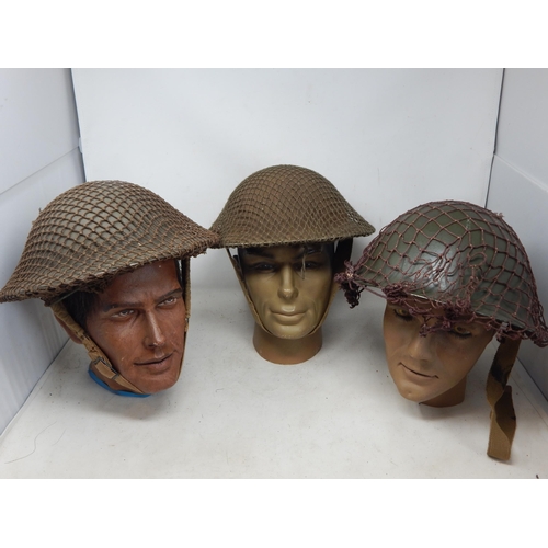 297 - WWII Brodie Helmets with Netting (3). Please Note: Customers must satisfy themselves prior to biddin... 