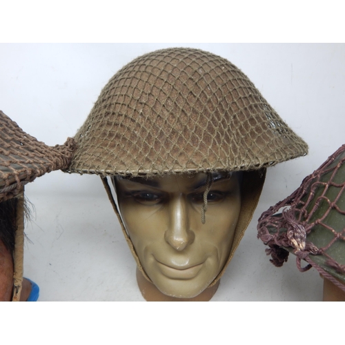 297 - WWII Brodie Helmets with Netting (3). Please Note: Customers must satisfy themselves prior to biddin... 