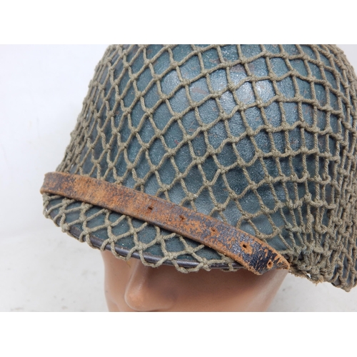 546 - WWII German M42 Helmet with Camouflage Netting. Numbered Inside ET62 & Painted Name 