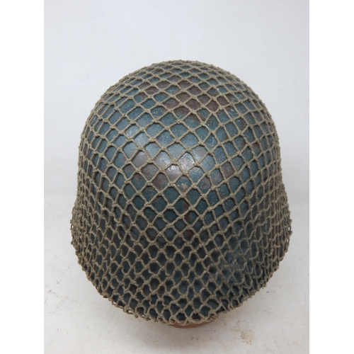 546 - WWII German M42 Helmet with Camouflage Netting. Numbered Inside ET62 & Painted Name 