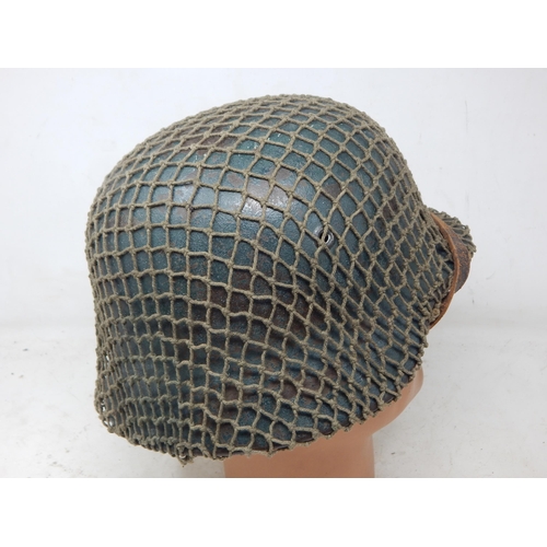 546 - WWII German M42 Helmet with Camouflage Netting. Numbered Inside ET62 & Painted Name 