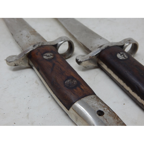 547 - A Pair of 1903 Dated Bayonet Daggers: Length 29cm