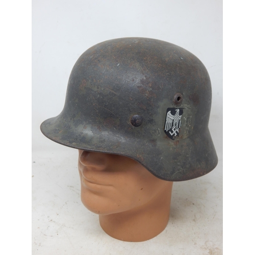 551 - WWII German M35 Helmet. Numbered Inside 3083. Please Note: Customers must satisfy themselves prior t... 