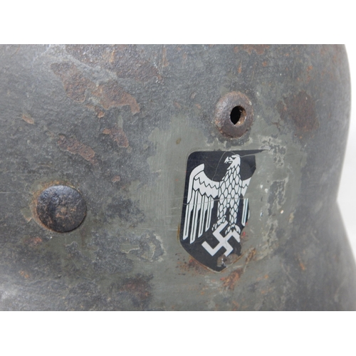 551 - WWII German M35 Helmet. Numbered Inside 3083. Please Note: Customers must satisfy themselves prior t... 