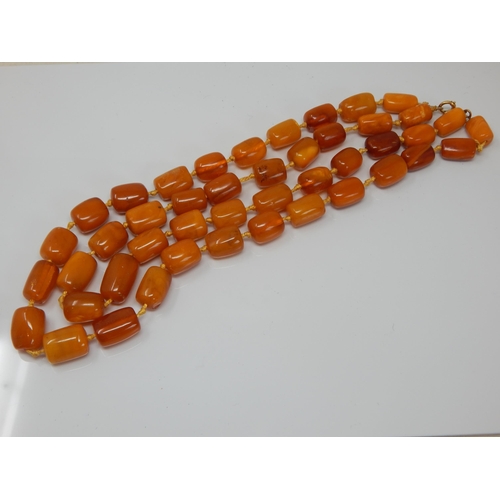 216 - Antique 9ct Gold Clasped Butterscotch Amber Double Strand Individually Knotted Necklace: Length 56cm... 