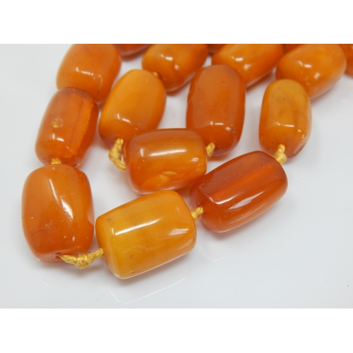 216 - Antique 9ct Gold Clasped Butterscotch Amber Double Strand Individually Knotted Necklace: Length 56cm... 