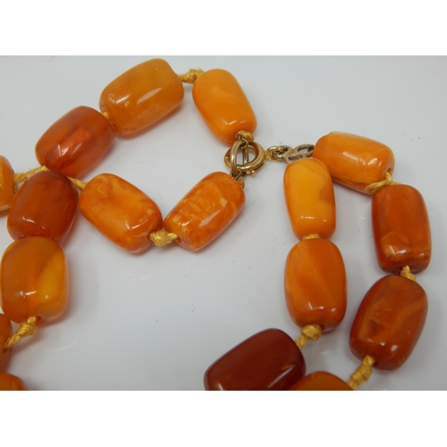 216 - Antique 9ct Gold Clasped Butterscotch Amber Double Strand Individually Knotted Necklace: Length 56cm... 