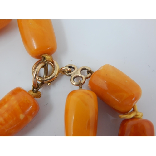 216 - Antique 9ct Gold Clasped Butterscotch Amber Double Strand Individually Knotted Necklace: Length 56cm... 