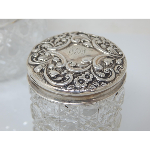 110 - Antique Silver Mounted Dressing Table Jars together with a Silver Mounted Circular Brush.