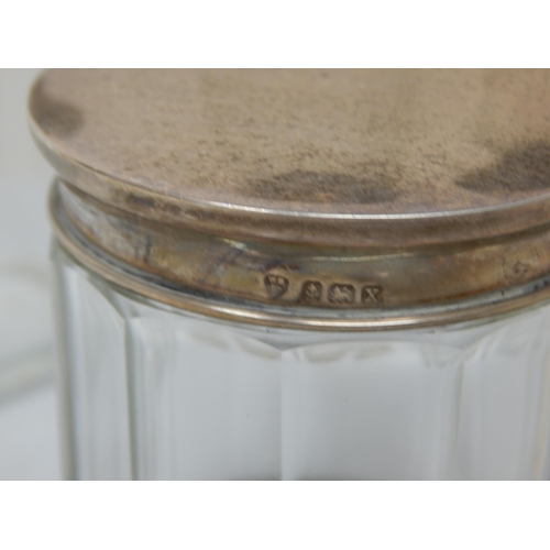 119 - A Collection of 9 Hallmarked Silver Topped Dressing Table Jars: Various Dates & Makers.