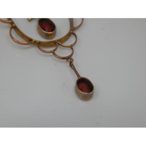 225 - Edwardian 9ct Gold Garnet & Seed Pearl Set En-tremble pendant on 9ct Chain. Gross weight 3.02g