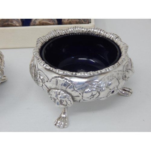 136 - A Pair of 18th Century unmarked white metal salts together with a set of 4 sterling silver salts by ... 