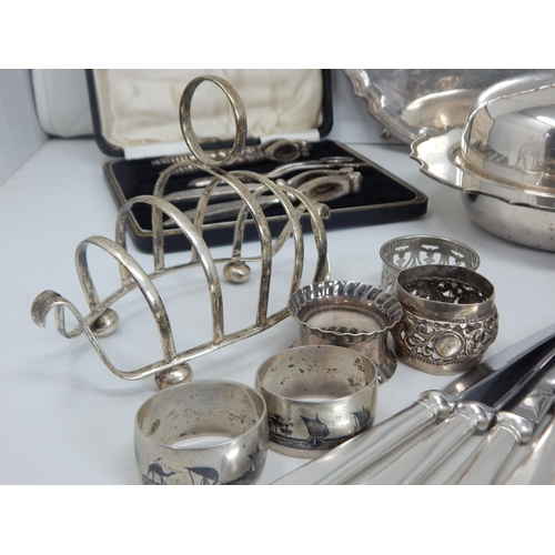 138 - A Quantity of Silver Plated Wares & White Metal Including Toast Racks, Napkin Rings, Salver, Flatwar... 