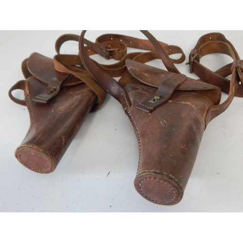 975 - WWII Gun Holsters, one dated 1944 on Shoulder belts (2)