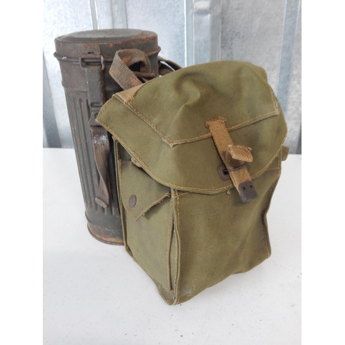 976 - WWII German Soldiers Gas Mask in Tin Cannister together with a British Soldiers Gas Mask in Canvas B... 